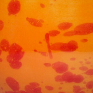 orange Glasur mit roten Sprenkeln